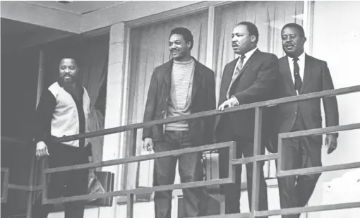  ?? AP ?? On April 3, 1968, the day before the assassinat­ion of the Rev. Martin Luther King Jr., the civil rights leader stood on the balcony of the Lorraine Motel in Memphis, Tennessee, with Hosea Williams and Jesse Jackson on his right and Ralph Abernathy on his left.