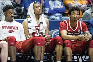  ?? NWA Democrat-Gazette/BEN GOFF ?? Arkansas players watch from the bench during the closing minutes of the Razorbacks’ loss to Florida on Thursday at the SEC Tournament in Nashville, Tenn. Arkansas lost its opening game of the tournament for the first time since 2016.
