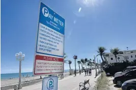  ?? TAIMY ALVAREZ/STAFF PHOTOGRAPH­ER ?? Hollywood’s Broadwalk runs 2.5 miles, giving visitors a place to bike, jog and stroll. It was named one of America’s Best Beach Boardwalks by Travel + Leisure magazine,