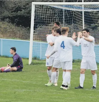  ?? PICTURES BY KATE SHEMILT KS190145 ?? Selsey players celebrate one of the three goals that earned them victory at Midhurst