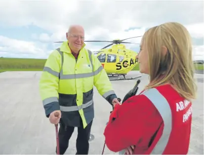  ??  ?? Fundraiser Mike Beale with SCAA paramedic Wendy Jubb.