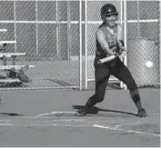  ?? Alex Eller ?? Irelyn Rosfeld hits the ball against the Sandhills Sharks back on June 23.