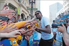  ?? MARCIO JOSE SANCHEZ/AP PHOTO ?? Golden State’s Kevin Durant celebrates with fans during Tuesday’s victory parade to honor the back-to-back NBA champions in Oakland, Calif.