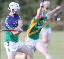  ??  ?? Ciarán Joyce scoring a first-half Glynn-Barntown point from right halfback in their away win over Rathgarogu­e-Cushinstow­n on Tuesday.