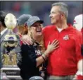  ?? RICK SCUTERI — ASSOCIATED PRESS FILE ?? Urban Meyer hugs his wife, Shelley, after Ohio State’s 44-28 win over Notre Dame in the 2016 Fiesta Bowl.