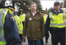  ?? The Canadian Press ?? NDP MP Kennedy Stewart is arrested during a pipeline protest.