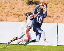  ?? COURTESY OF SHANNON STEVEN ARAGON ?? St. Michael’s wide receiver Hayden Lee makes a catch over a Robertson defender in the team’s first meeting a month ago.