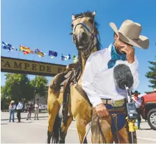  ?? AZIN GHAFFARI ?? The 2020 Calgary Stampede parade marshal Filipe Masetti Leite is overwhelme­d by emotions while he recounts his journey outside Stampede Park on Friday. His travels on horseback covered more than 25,000 km through the Americas over eight years.