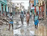  ?? LOGAN ABASSI/U.N. MISSION IN HAITI ?? Haitians salvage what they can in Jeremie, a town on the western tip of the country. Hundreds died in the hurricane.