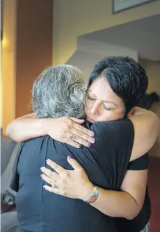  ?? ARLEN REDEKOP ?? Shooting victim Willis Hunt’s cousin Christine Smith-Martin hugs his mother Sunni on Monday. The 33-year-old was killed Friday.