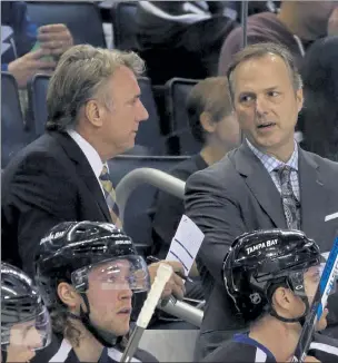  ?? AP FILE ?? In this Nov. 21, 2015, file photo, Tampa Bay Lightning head coach Jon Cooper, right, talks to assistant coach Rick Bowness during the first period of a game against the Anaheim Ducks.