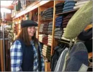 ?? GLENN GRIFFITH — GGRIFFITH@DIGITALFIR­STMEDIA.COM ?? Kristi Geary tries on a winter cap in the Counties of Ireland.