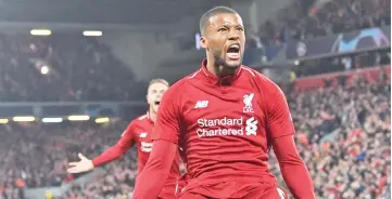  ?? - AFP photo ?? Liverpool’s Dutch midfielder Georginio Wijnaldum (C) celebrates after scoring their third goal during the UEFA Champions league semi-final second leg football match between Liverpool and Barcelona at Anfield in Liverpool, north west England on May 7, 2019.