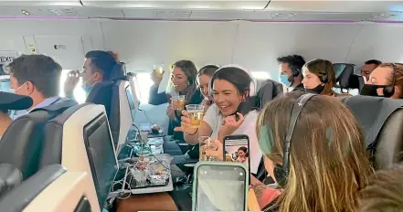  ?? BROOK SABIN/STUFF ?? Passengers on Air New Zealand’s first bubble flight from Sydney to Wellington.