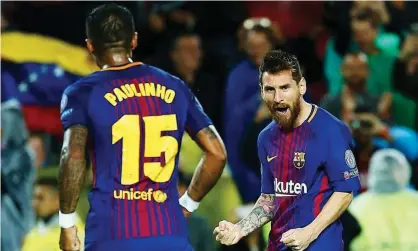  ??  ?? Lionel Messi, right, celebrates scoring Barcelona’s second in the 3-1 win against Olympiakos, his 100th goal in European competitio­n. Photograph: Alejandro Garcia/EPA