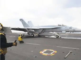  ?? PETTY OFFICER 2ND CLASS SOPHIE A. PINKHAM/U.S. NAVY ?? An F/A-18E Super Hornet, attached to Strike Fighter Squadron (VFA) 83, launches from the USS Dwight D. Eisenhower in support of operations against the Islamic State on Wednesday.