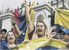  ??  ?? 0 Venezuelan­s protest against president Nicolas Maduro