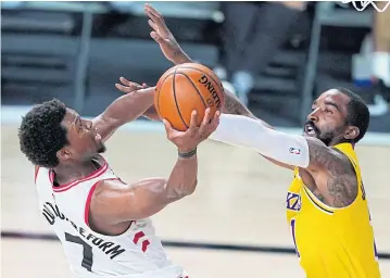  ?? USA TODAY SPORTS ?? Raptors guard Kyle Lowry shoots the ball against Lakers guard JR Smith during the second half.