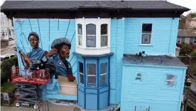  ?? Photograph: MediaNews Group/East Bay Times/Getty Images ?? A mural on Jilchristi­na Vest’s home in Oakland, California, honors the women of the Black Panther party.