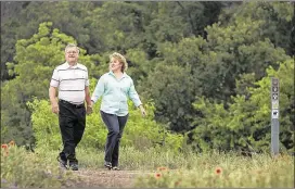  ?? RALPH BARRERA / AMERICAN-STATESMAN ?? Andy Rainosek and his fiancee, Francoise Luca, both live in the Gracywoods neighborho­od near theWalnut CreekMetro­politan Park.