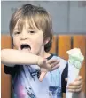  ??  ?? Joseph Jarrat, 4, eating an ice cream