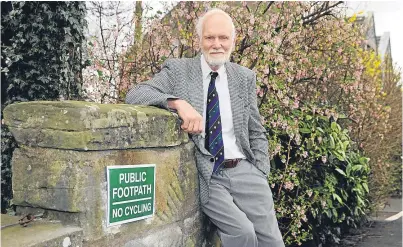  ??  ?? David Middleton of Lade Braes Walk in St Andrews by one of his cycling signs.