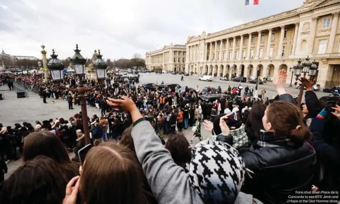  ?? ?? Fans shut down Place de la Concorde to see BTS' Jimin and J-Hope at the Dior Homme show.