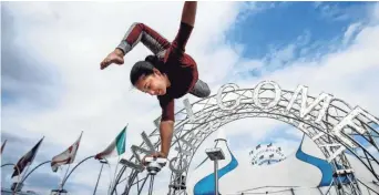  ?? THE COMMERCIAL APPEAL FILE ?? Contortion­ist Julliet Carballo, a sixth-generation circus performer, practices her routine while rehearsing for the Cirque Italia water circus event in the parking lot of Wolfchase Galleria in 2016. The water circus returns to the Memphis area this month.