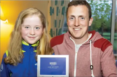  ??  ?? After nine years, Ciara Nolan receives her christenin­g gift from her cousin Tom Connick.