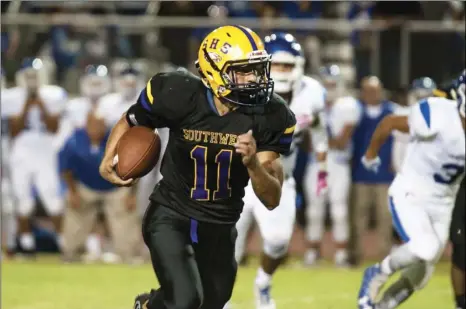  ?? SERGIO BASTIDAS PHOTO ?? Southwest High’s Justin Cordova runs the ball against Central Union High during the Annual City Championsh­ip game held at Southwest High on Friday night in El Centro.