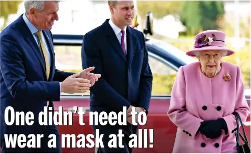  ??  ?? On the road again: The Queen – minus a mask – visits Porton Down yesterday