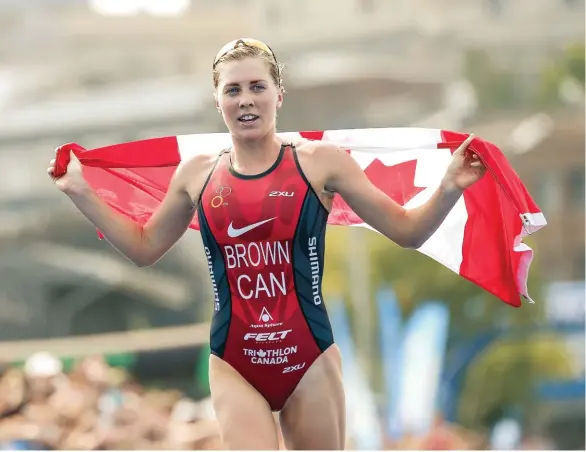  ??  ?? ABOVE Joanna Brown finishes fourth at the ITU World Triathlon Montreal