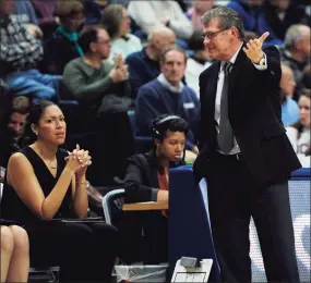  ?? Jessica Hill / Associated Press ?? UConn head coach Geno Auriemma, right, gestures to assistant coach Marisa Moseley in the first half of ana game in 2016, in Storrs.
