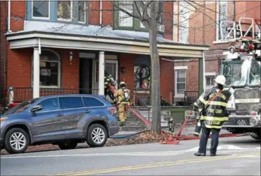  ?? MARIAN DENNIS – DIGITAL FIRST MEDIA ?? Firefighte­rs quickly extinguish­ed a fire that was found between the first and second floor of a building on North Hanover Street Tuesday.