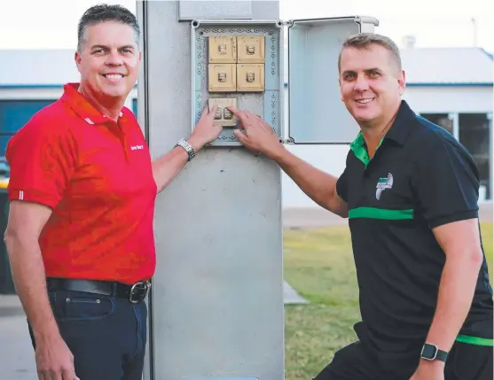  ?? SWITCHED ON: Thuringowa MP Aaron Harper ( left) and Townsville Blackhawks CEO Justin Wilkins with the upgraded lights at Jack Manski Oval. Picture: ALIX SWEENEY ??