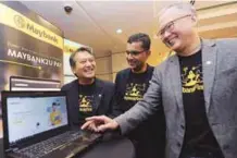  ?? ZULKIFLI ERSAL/ THESUN ?? From left: Maybank group chief financial officer Datuk Amirul Feisal Wan Zahir, chief technology officer Mohd Suhail Amar Suresh and chief strategy officer Michael Foong during the Maybank Group Digital Day Briefing in Kuala Lumpur yesterday.