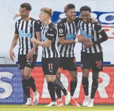  ?? — Reuters ?? Newcastle United’s Joe Willock celebrates scoring their third goal with teammates.