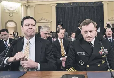  ?? Drew Angerer Getty Images ?? FBI DIRECTOR James B. Comey, left, and National Security Agency Director Mike Rogers on Capitol Hill.