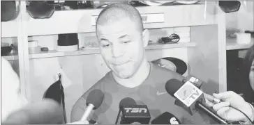  ?? Mike Sturk, ?? Calgary Flames’ captain Jarome Iginla talks to the media after their final NHL hockey game of the season on Saturday.