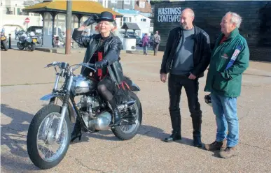  ?? ?? Hastings Bonfire Society mover and shaker (and motorcycli­st) Twig Goodyear tries Mark Trown’s Trail Twin for size, Mark (in riding kit) looks on.