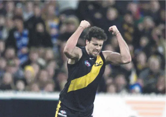  ?? Picture: News Limited ?? GUEST STAR: Matthew Richardson celebrates his winning goal for Richmond against North Melbourne Kangaroos.