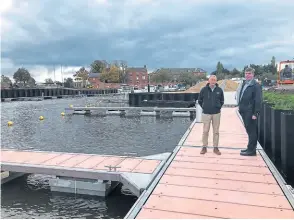  ?? PHOTO SUPPLIED ?? Viewing work on the new extension are Newark Marina MD James Wilkinson with Jon Challis, sales manager at Inland and Coastal.