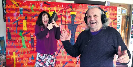  ?? PHOTO: STEPHEN JAQUIERY ?? Art for music’s sake . . . Sarah McDougall and artist Ewan McDougall in front of his artwork, The Way to Paradise, the inspiratio­n for a jazz compositio­n about to be toured in New Zealand.