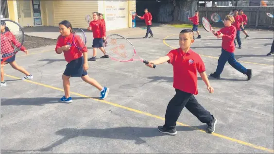  ??  ?? Ebbett Park School students practise their tennis moves.