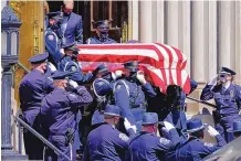  ?? DAVID ZALUBOWSKI/ ASSOCIATED PRESS ?? A police honor guard carries the casket of fallen Boulder officer Eric Talley after a funeral Mass on Monday at the Cathedral Basilicia of the Immaculate Conception in Denver. Talley grew up in Albuquerqu­e.