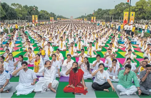  ??  ?? Swami Ramdev participat­es in a rehearsal for Internatio­nal Yoga Day on Rajpath in New Delhi in June this year.