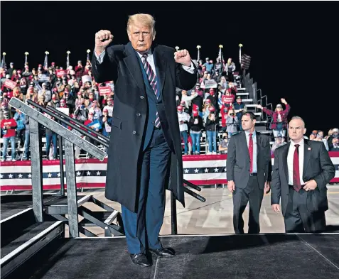  ??  ?? Donald Trump, the incumbent US president, dances as he leaves the stage after speaking during an election campaign rally at Bemidji Regional Airport in Minnesota on Friday