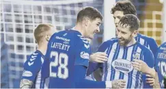  ??  ?? 0 Kyle Lafferty, centre, celebrates his third goal for Kilmarnock