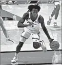  ?? HOLLY HART/AP ?? Illinois guard Ayo Dosunmu drives against Wisconsin on Saturday in Champaign.