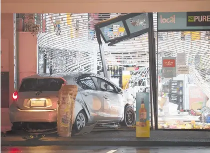  ?? Photo / Hayden Woodward ?? Videos of ram-raid burglaries such as this one at the Liquor Centre in Greenhithe, Auckland, in May are believed to be fuelling copycat crimes.